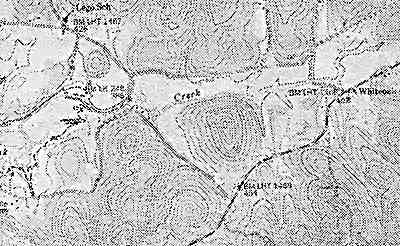 
A topographic map indicates streams, lakes, roads, buildings, wooded areas and the contour and elevation of the land. 

